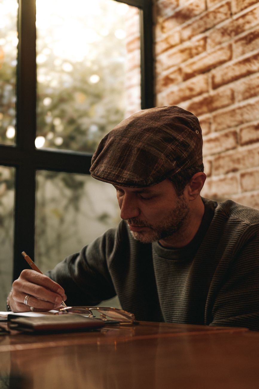 Travel writer documenting field notes in a quiet sanctuary lodge