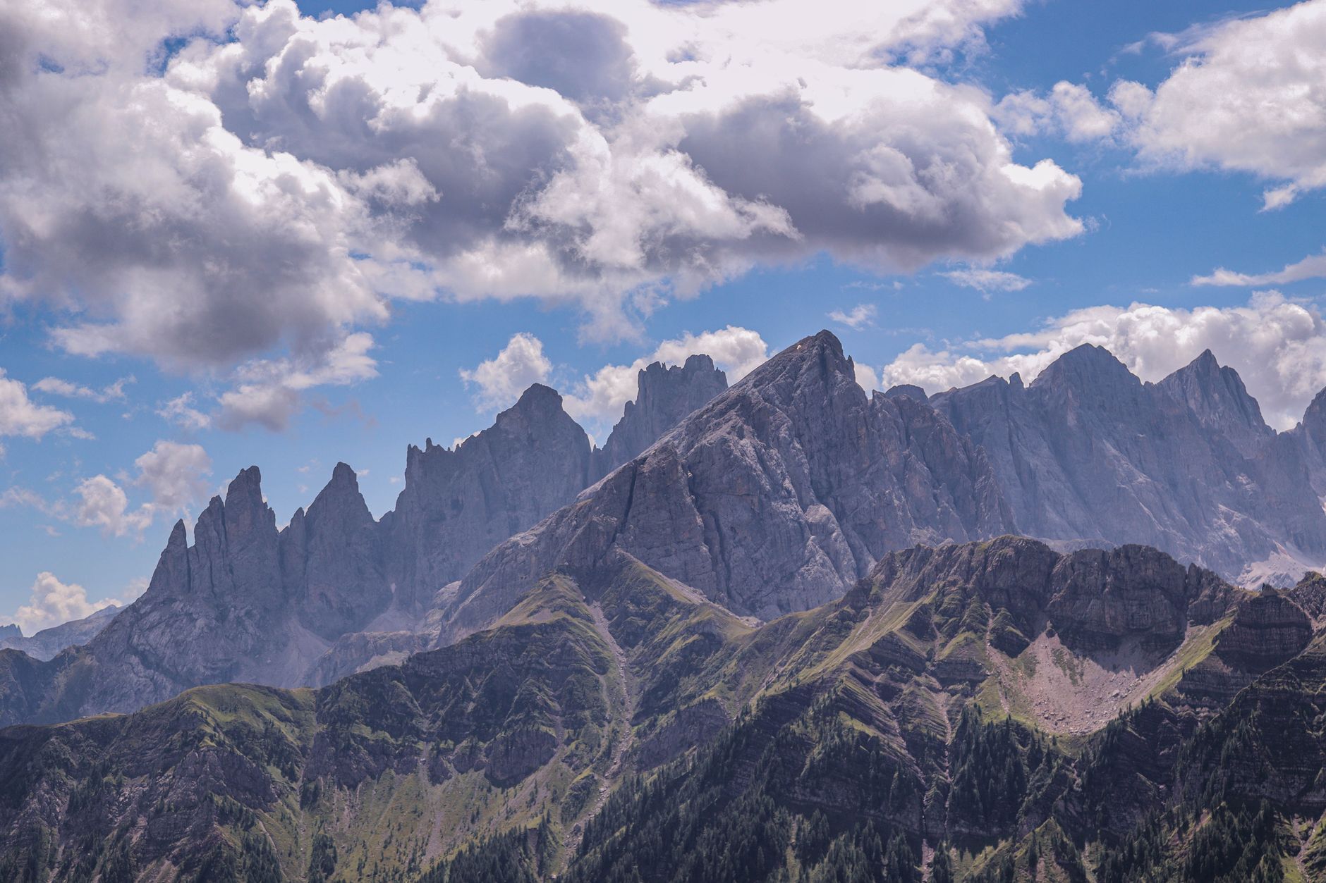 Limestone peaks rising through mist in the Dolomites